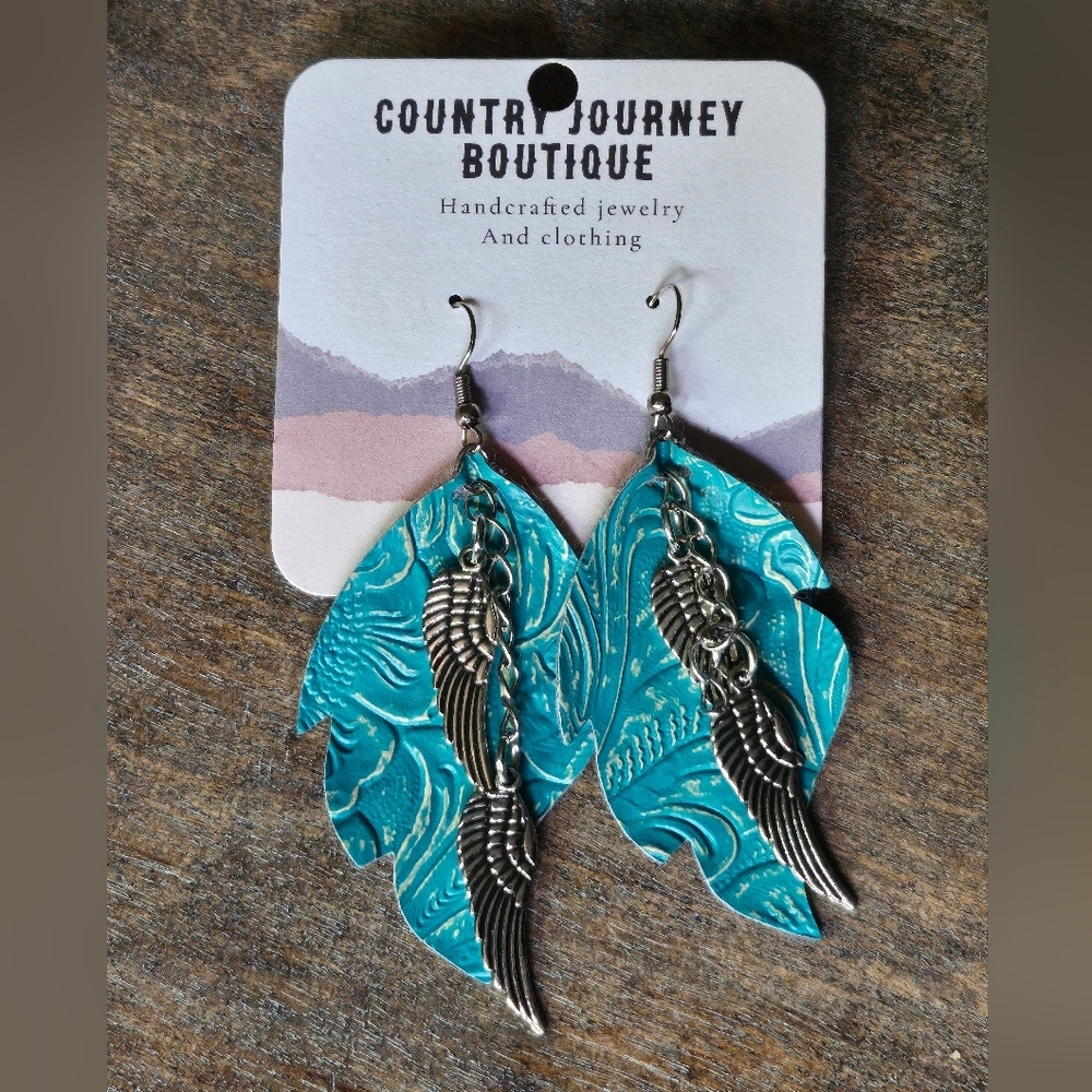 NWT Blue western style turquoise faux leather earrings with a silver Wings